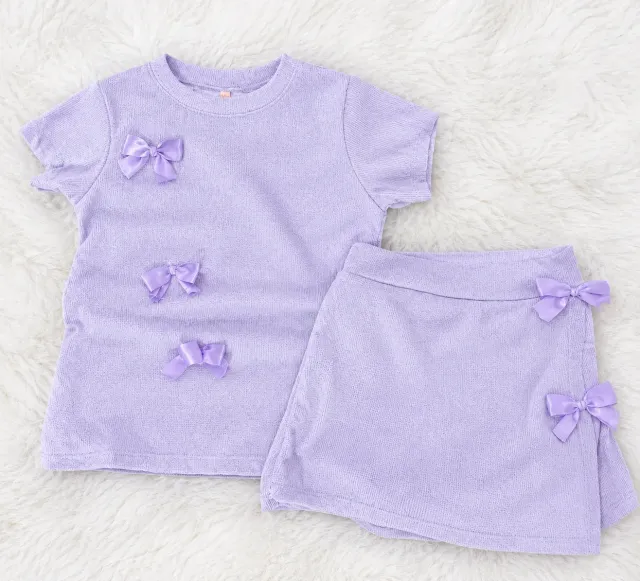 Conjunto de nena con moños lila talle 16