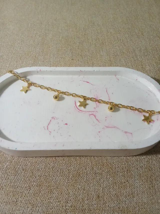 Pulcera acero dorado con dijes